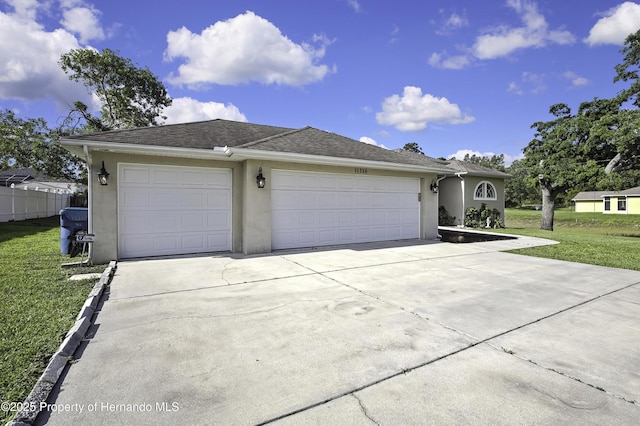 11336 Flower Ave, Weeki Wachee, FL 34613 - single story home with fence, driveway, a garage, stucco siding, and a front lawn
