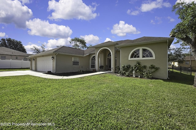 11336 Flower Ave, Weeki Wachee, FL 34613 - view of front of house featuring driveway, stucco siding, an attached garage, and fence