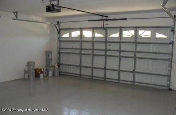 4301 Blakemore, Spring Hill, FL 34609 - garage featuring a garage door opener