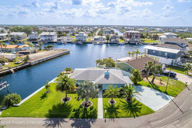 aerial view of residential area with a large body of water