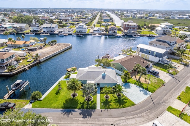 aerial perspective of suburban area featuring a nearby body of water