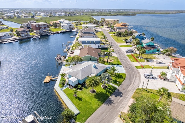 aerial perspective of suburban area featuring a large body of water