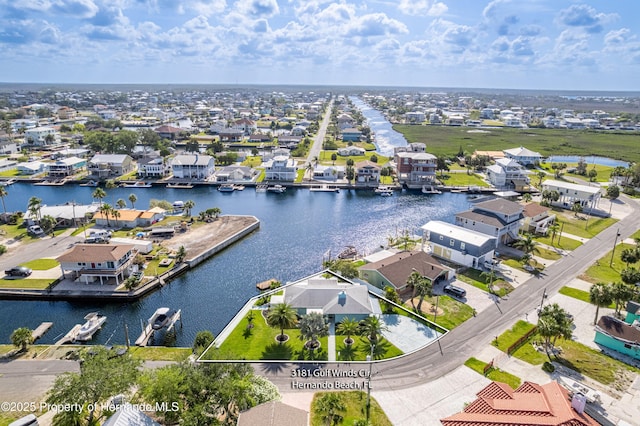 aerial perspective of suburban area with a large body of water