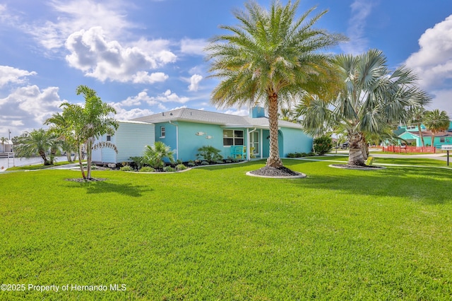 view of front of home with a front lawn