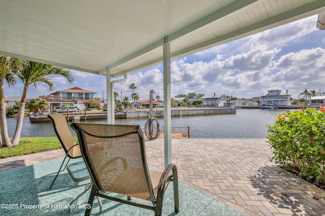 view of patio with a water view and a residential view