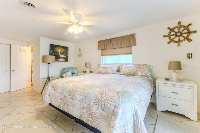 bedroom with light tile patterned floors and ceiling fan