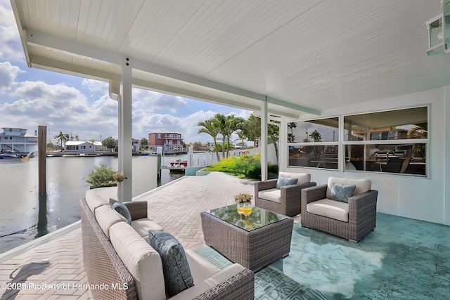 view of patio featuring an outdoor hangout area and a water view