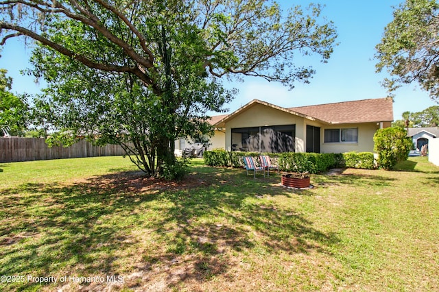5078 Kenmore St, Spring Hill, FL 34608 - rear view of property with stucco siding