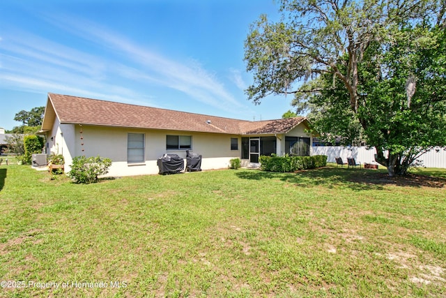 5078 Kenmore St, Spring Hill, FL 34608 - back of property featuring stucco siding and central AC unit