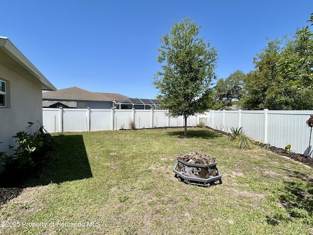 15585 Rene Ct, Brooksville, FL 34604 - view of yard with an outdoor fire pit