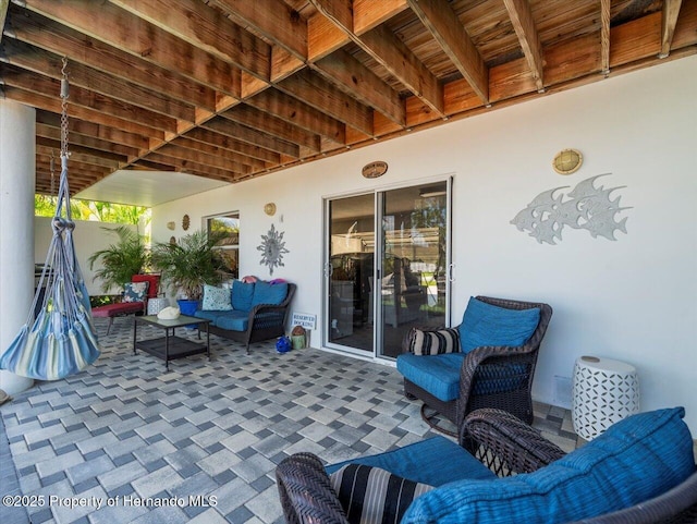 view of patio / terrace featuring an outdoor living space and fence