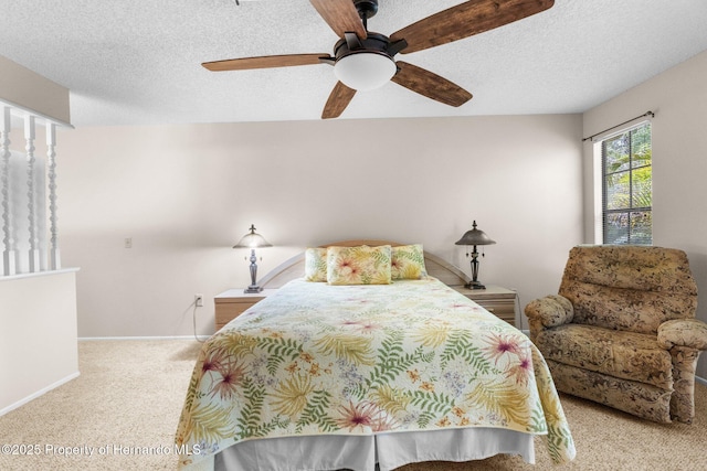 carpeted bedroom featuring a textured ceiling, baseboards, and a ceiling fan