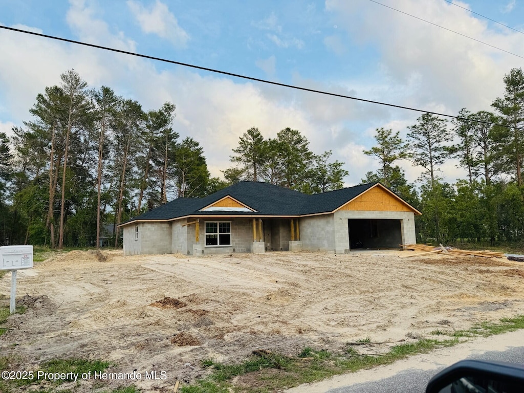 property in mid-construction with a garage