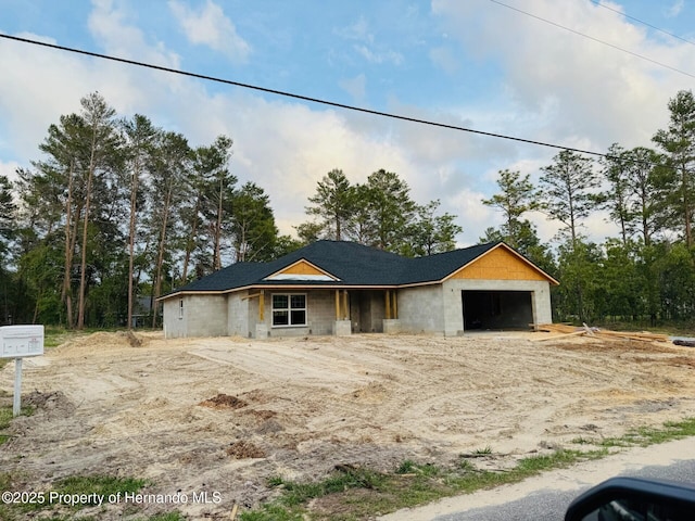property in mid-construction with a garage