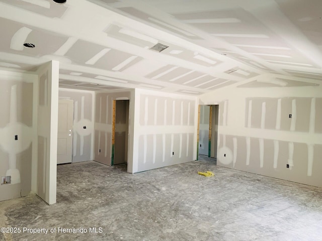 11406 Labrador Duck Rd, Weeki Wachee, FL 34613 - empty room with vaulted ceiling