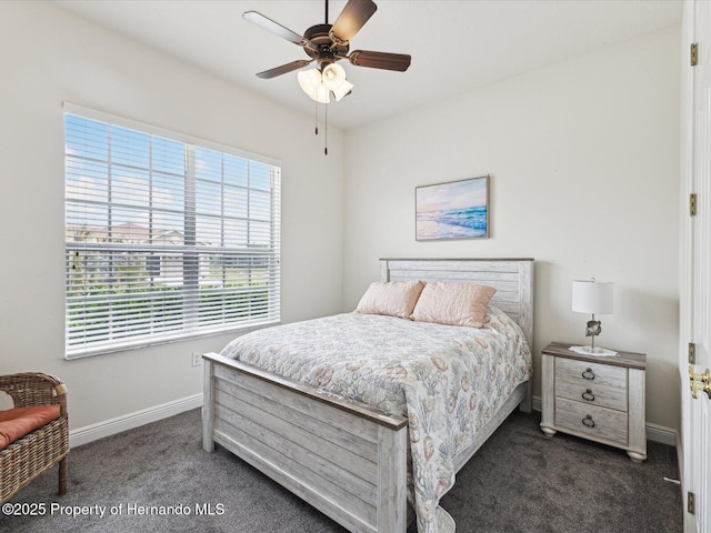 bedroom with carpet flooring, baseboards, and a ceiling fan