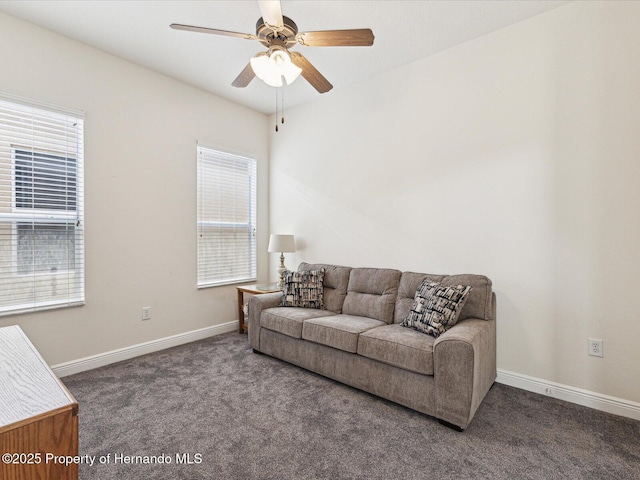 living room featuring carpet floors, baseboards, and a ceiling fan