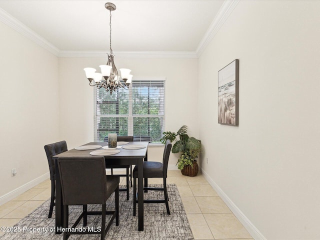 dining area featuring light tile patterned floors, a chandelier, crown molding, and baseboards
