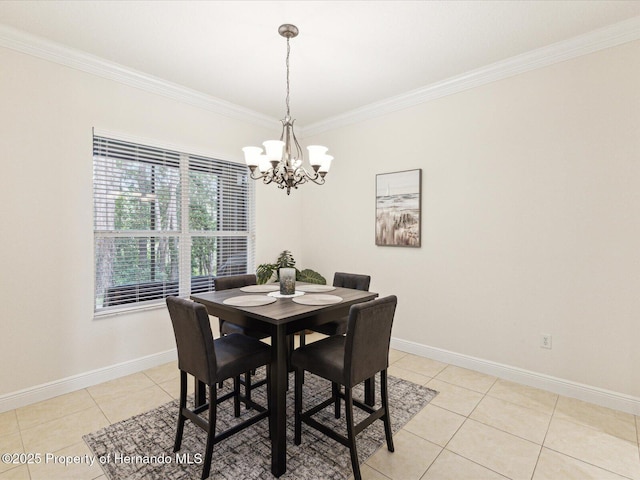 dining room with a chandelier, crown molding, light tile patterned floors, and baseboards