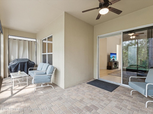view of patio with ceiling fan