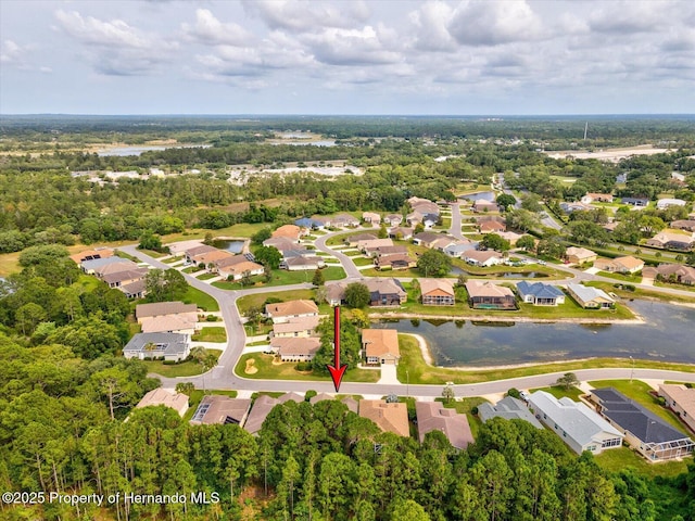 view of property location with nearby suburban area and a large body of water
