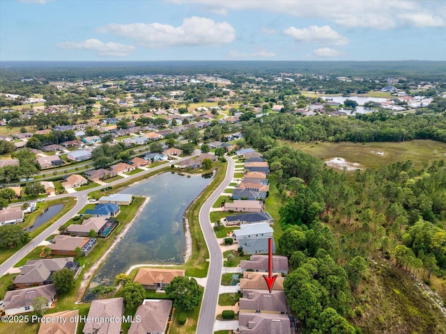 aerial overview of property's location with nearby suburban area and a large body of water