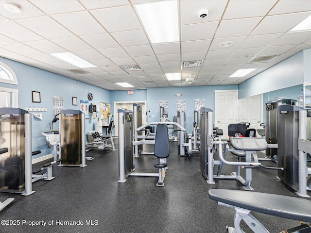 exercise room with a drop ceiling
