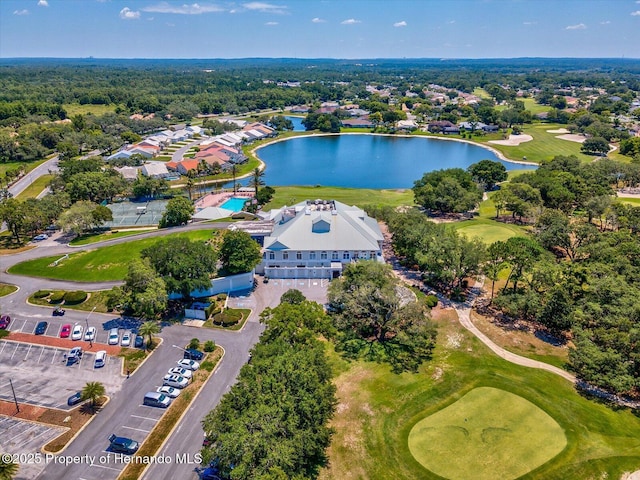 bird's eye view of a nearby body of water and a golf course