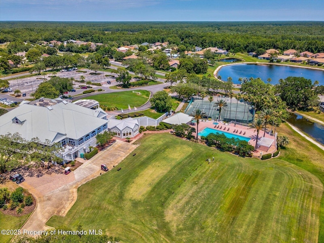 drone / aerial view of a large body of water and a pool