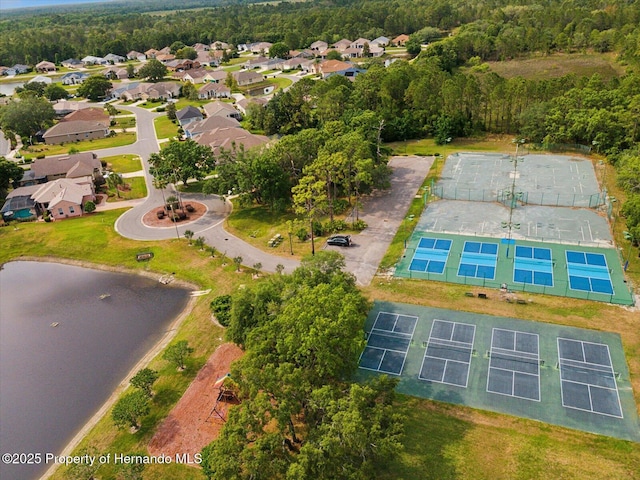 aerial view of residential area featuring a nearby body of water