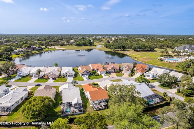aerial perspective of suburban area featuring a nearby body of water