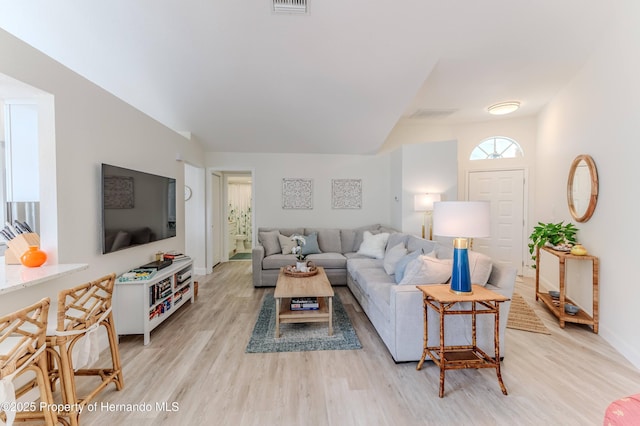 living room with light wood finished floors and baseboards