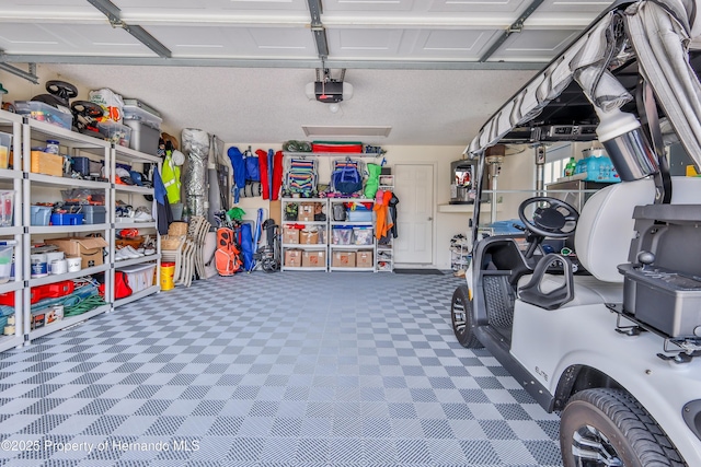 garage featuring a garage door opener
