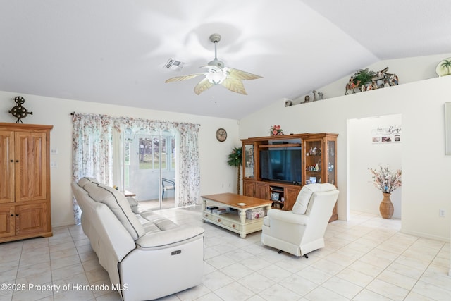 12271 House Finch Rd, Weeki Wachee, FL 34614 - living area with lofted ceiling, a ceiling fan, and light tile patterned floors