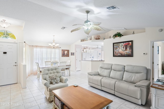 12271 House Finch Rd, Weeki Wachee, FL 34614 - living area with vaulted ceiling, a chandelier, a ceiling fan, plenty of natural light, and light tile patterned floors