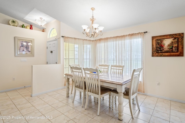 12271 House Finch Rd, Weeki Wachee, FL 34614 - dining room with a chandelier, vaulted ceiling, and baseboards