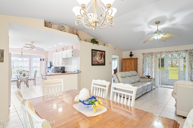 12271 House Finch Rd, Weeki Wachee, FL 34614 - dining space featuring light tile patterned floors, ceiling fan, vaulted ceiling, and a chandelier