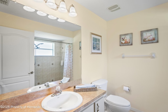 12271 House Finch Rd, Weeki Wachee, FL 34614 - bathroom featuring toilet, vanity, and curtained shower