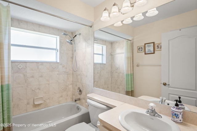 12271 House Finch Rd, Weeki Wachee, FL 34614 - full bathroom featuring shower / tub combo, plenty of natural light, toilet, and vanity