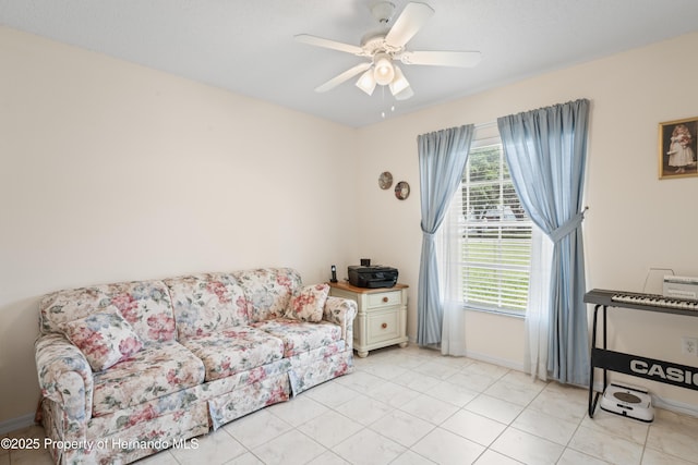 12271 House Finch Rd, Weeki Wachee, FL 34614 - living area featuring ceiling fan, baseboards, and light tile patterned flooring