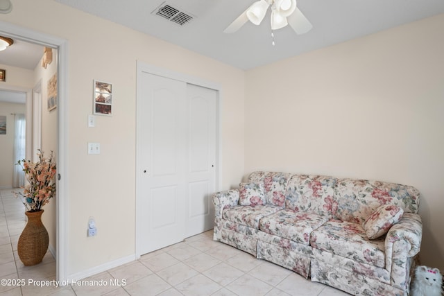 12271 House Finch Rd, Weeki Wachee, FL 34614 - living area with a ceiling fan and light tile patterned floors