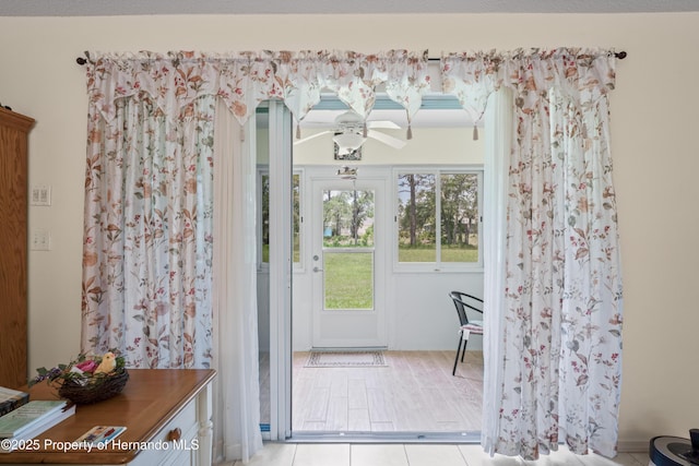 12271 House Finch Rd, Weeki Wachee, FL 34614 - doorway to outside with ceiling fan