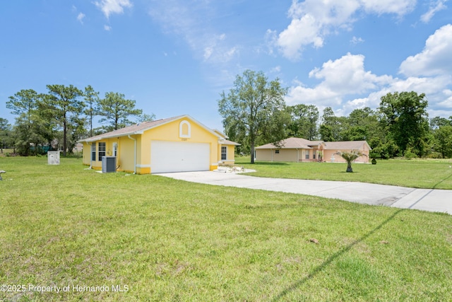 12271 House Finch Rd, Weeki Wachee, FL 34614 - ranch-style house with stucco siding, driveway, cooling unit, a garage, and a front yard