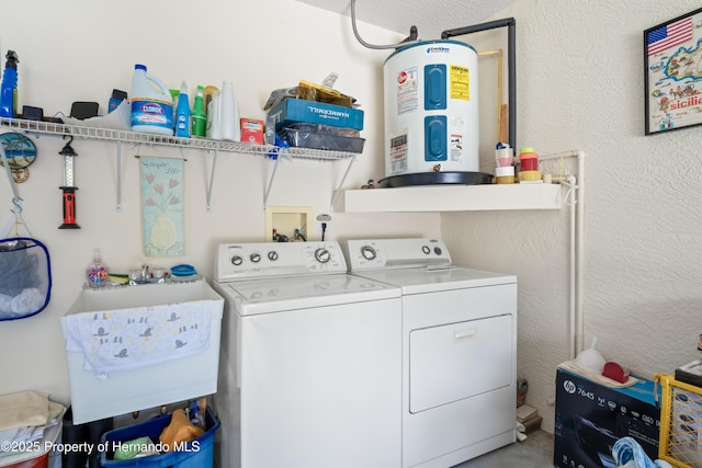 12271 House Finch Rd, Weeki Wachee, FL 34614 - laundry room with water heater and washer and dryer