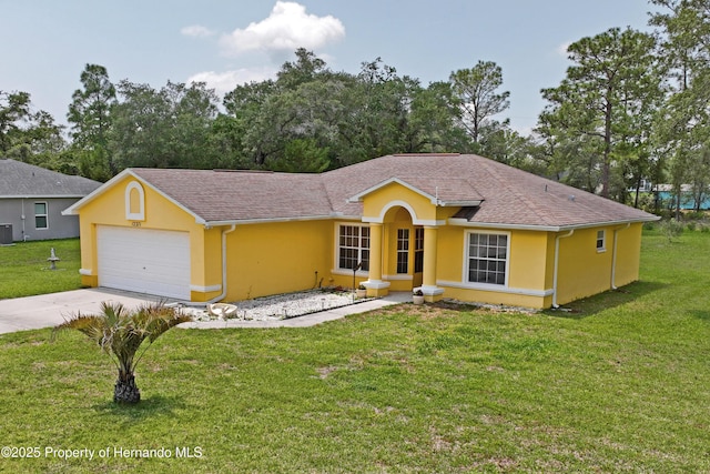12271 House Finch Rd, Weeki Wachee, FL 34614 - ranch-style home featuring stucco siding, driveway, and a front lawn