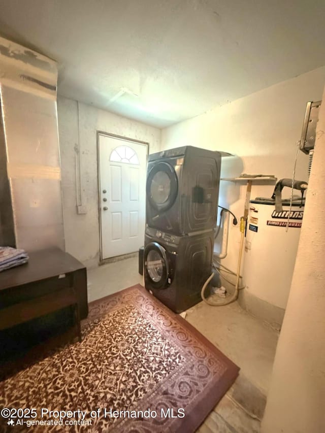 11080 Jackdaw Rd, Weeki Wachee, FL 34613 - laundry area featuring stacked washer / drying machine