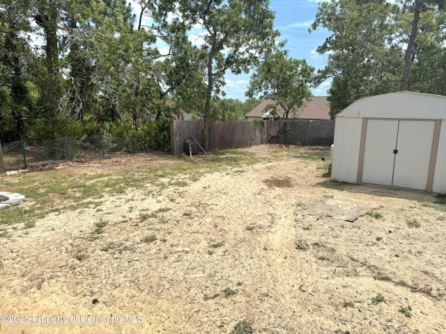 11080 Jackdaw Rd, Weeki Wachee, FL 34613 - fenced backyard featuring a storage shed and an outdoor structure