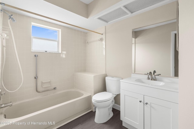full bath with toilet, bathing tub / shower combination, vanity, and wood finished floors