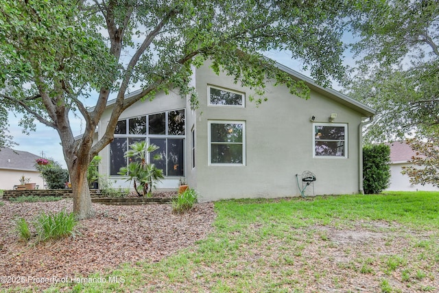 11750 Teapot Ct, Spring Hill, FL 34609 - view of home's exterior featuring stucco siding