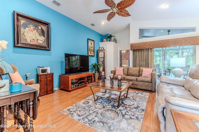 11750 Teapot Ct, Spring Hill, FL 34609 - living room featuring wood finished floors, ceiling fan, and lofted ceiling